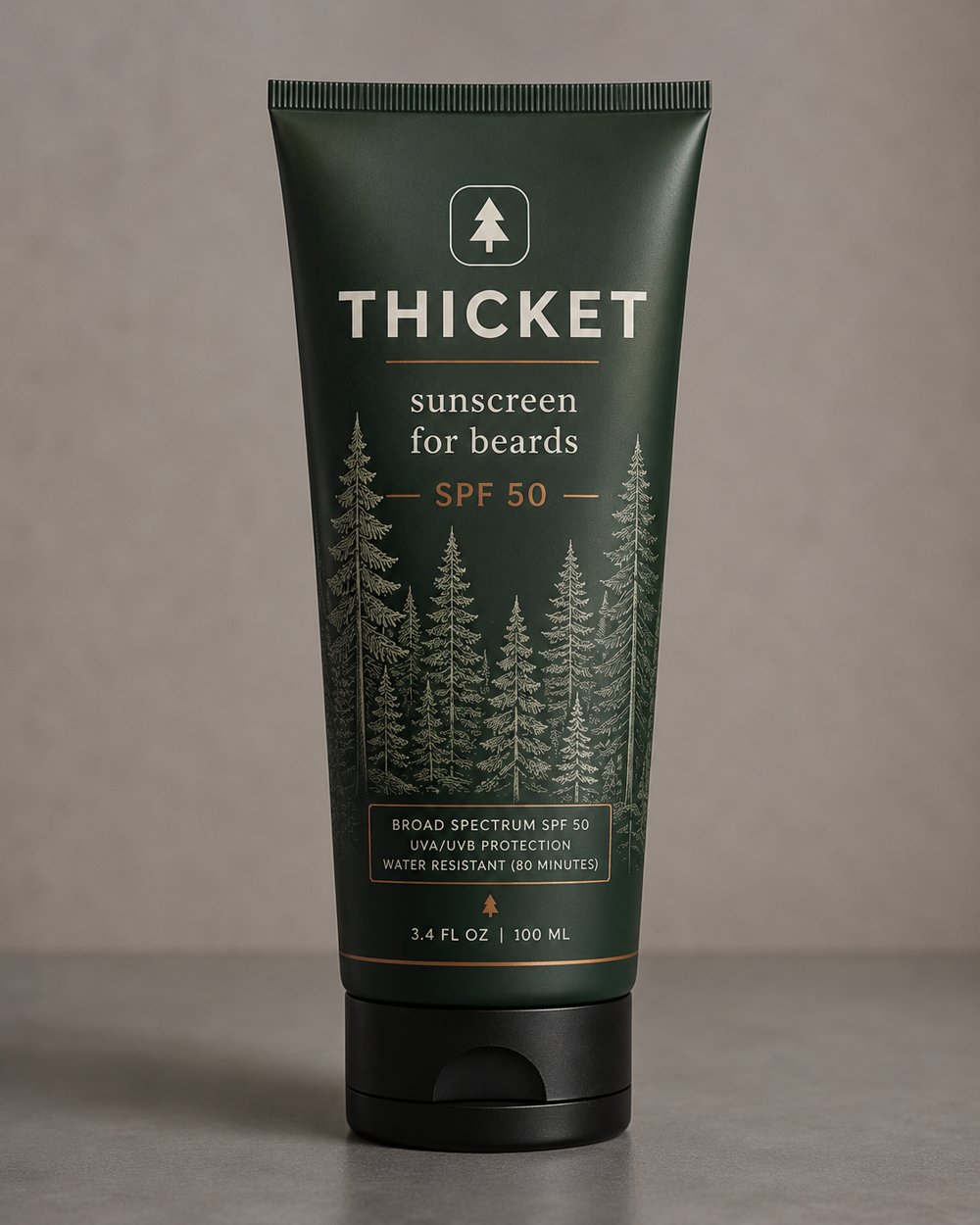 Thicket SPF 50 sunscreen for beards. Dark green tube with engraved pine forest label